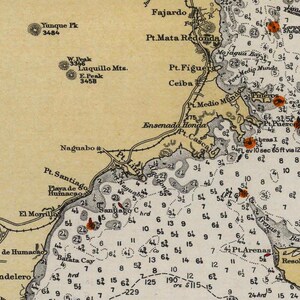 May include: A vintage nautical chart of the coast of Puerto Rico, showing depths, shoals, and landmarks. The chart includes the names of locations like "Pt. Santiago", "Pt. Figuera", and "Pt. Mata Redonda".
