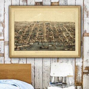 May include: An antique, hand-colored lithograph depicting a bird's eye view of the city of Louisville, Kentucky. The map shows the city's streets, buildings, and the Ohio River.