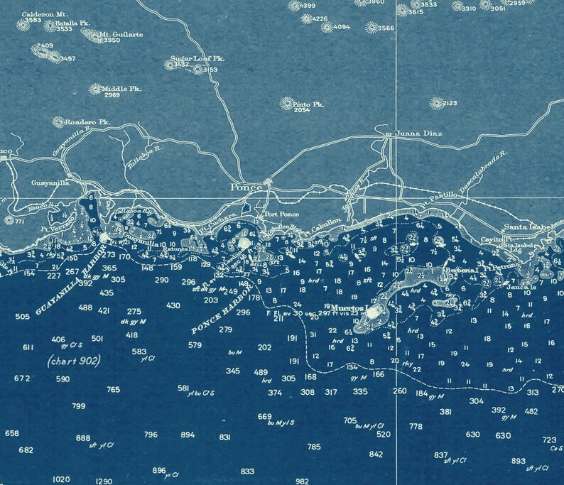 May include: A vintage nautical chart of Ponce Harbor in Puerto Rico, showing depths in feet and nautical markers. The chart is printed on blue paper with white text and lines.