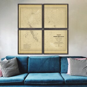 May include: A set of four vintage nautical charts framed in black wood. The charts are printed on aged paper with a cream background and black ink. The charts depict Georges Shoal & Bank.
