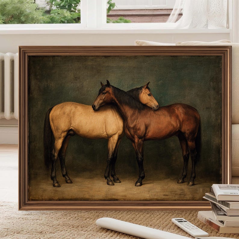 May include: A framed artwork featuring two horses. One horse is a light tan color, and the other is a rich brown. They are positioned close together, with their heads touching. The background is a dark, textured green.