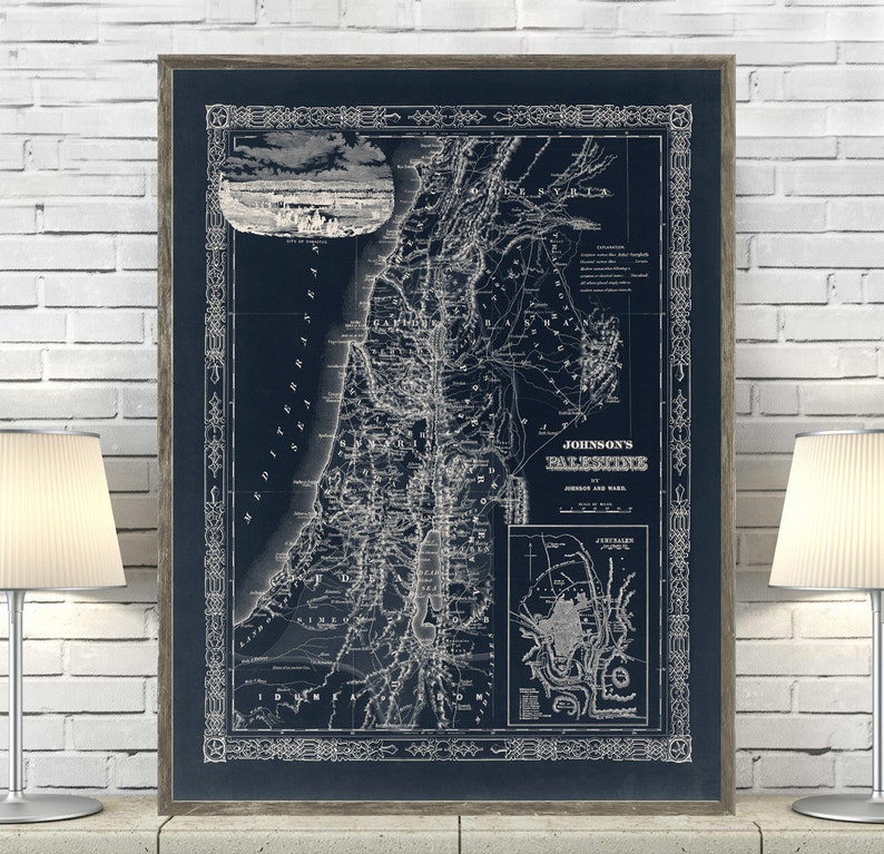 May include: A vintage map of Palestine, printed in white on a dark blue background. The map shows the major cities, towns, and geographical features of the region. The title of the map is "Johnson's Palestine" and the map is framed in a dark wood frame.