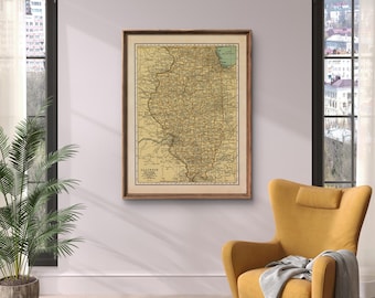 May include: A framed vintage map of Illinois, featuring a detailed depiction of the state's counties and geographical features. The map is in a wooden frame and has a cream-colored background with brown and green details.