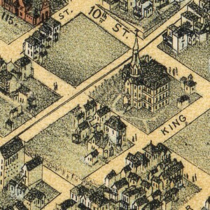 May include: An aerial view of a city block with a church in the center. The church has a tall steeple and is surrounded by houses. The street names "10th St." and "King" are visible.