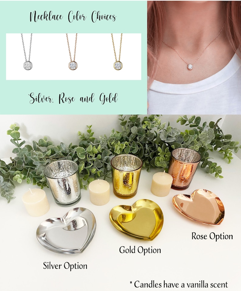 May include: Three silver, rose gold, and gold necklaces with a small round pendant. Below the necklaces are three heart-shaped trays in silver, gold, and rose gold. Each tray has a votive candle holder and a candle on a white surface. The text "Candles have a vanilla scent" is below the trays.