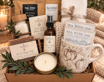 May include: A gift box containing a Gel-Ohh jelly spa bath set, a white fuzzy headband with a ribbon, two Tea With Tae tea bags, a mug with pumpkin illustrations, a candle, Oat & Honey soap, lotion, a shower steamer, and bath salts.