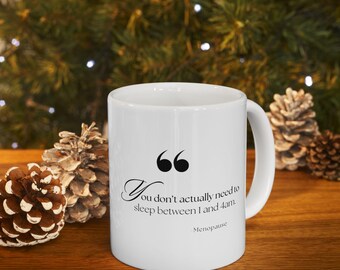 May include: White ceramic coffee mug with a black quote that reads "You don't actually need to sleep between 1 and 4 am. - Menopause".