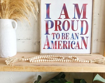 I am proud to be an American multi color letter framed wood quote sign