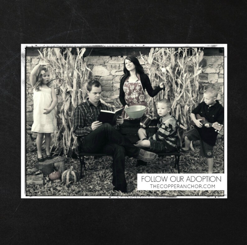 May include: A black and white photo of a family of five sitting in front of a cornfield. The family is smiling and looking at the camera. The text "FOLLOW OUR ADOPTION THECOPPERANCHOR.COM" is at the bottom of the photo.