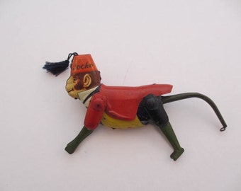 vintage MAR Line Toys metal Jocko monkey tin toy collectible made in japan occupied japan toy red jacket fez with tassel climbing toy