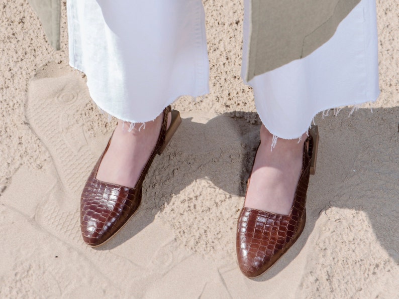 snakeskin slingback flats