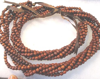 Houten riem met meerdere strengen kralen