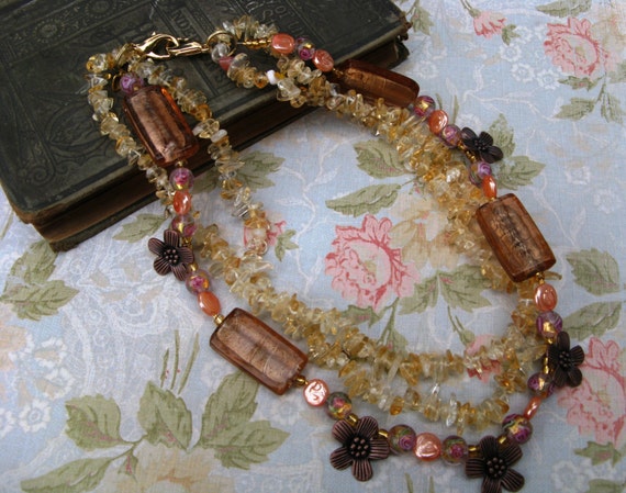 Field with Flowers tri-strand beaded necklace made with glass beads, copper flowers, polished yellow quartz chips