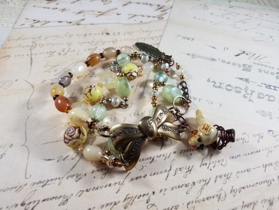 Bird on Nest Assemblage Bracelet, Brass Bow Bracelet, Feather and Nest Bracelet, Shabby Rose Neutral Bracelet, 4 Strand Beads Bracelet