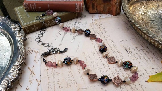 Boho Lampwork Glass Beaded Necklace with copper, satin glass, and wooden beads that is adjustable for length