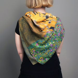 May include: A square silk scarf with a colorful abstract design. The scarf features a combination of yellow, green, blue, and purple hues. The design is reminiscent of a famous painting.