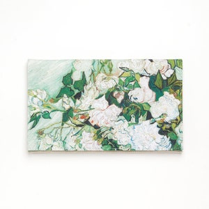 May include: A close-up of a painting of white flowers with green leaves. The flowers are painted in a style reminiscent of Vincent van Gogh.