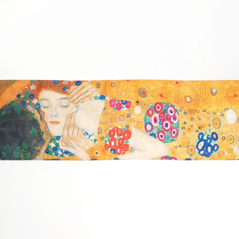 May include: A painting of a couple embracing, with the woman's head resting on the man's shoulder. The background is a vibrant yellow with a pattern of circles and squares. The woman has red hair and closed eyes, while the man's face is obscured by shadows. The painting is in a style reminiscent of Gustav Klimt.