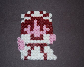 May include: A pink, white, and maroon pixel art character with a mushroom cap.