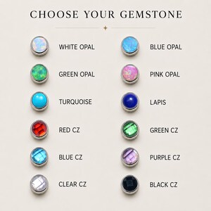 Puede incluir: Una tabla de selecci&oacute;n de piedras preciosas titulada CHOOSE YOUR GEMSTONE que muestra doce cabujones circulares y piedras facetadas en engastes met&aacute;licos. Las opciones incluyen &oacute;palo blanco, azul, verde y rosa, turquesa, lapisl&aacute;zuli y circonitas de colores.