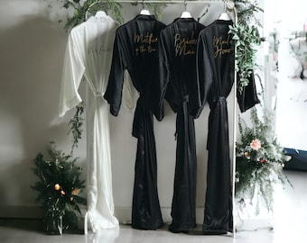Soft silky satin black personalized bridesmaid robes in ankle, calf length, and plus size for flower girl, mothers and entire bride squad.