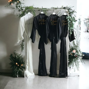 Soft silky satin black personalized bridesmaid robes in ankle, calf length, and plus size for flower girl, mothers and entire bride squad.