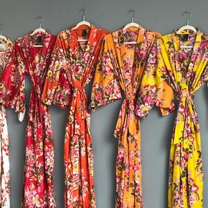 a group of women's robes hanging on a wall