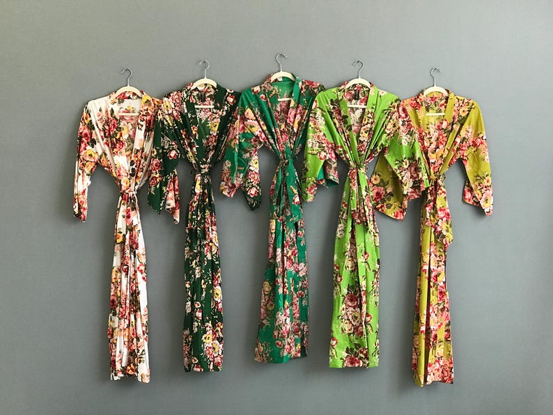 a group of women's kimonos hanging on a wall