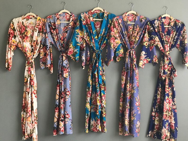 a group of women's robes hanging on a wall