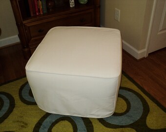 Custom made slipcover for your ottoman from your own fabric.  This one is Pottery Barn's dream nursery ottoman.