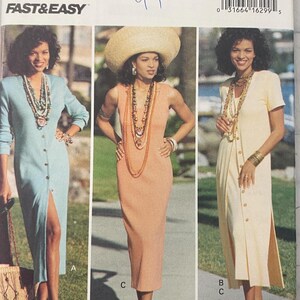 May include: Butterick Essence Collection sewing pattern featuring three dress designs. The pattern includes a light blue button-down dress, a peach sleeveless dress, and a short-sleeved yellow dress. The pattern size is 6-8-10.
