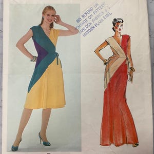 May include: Vogue American Designer sewing pattern featuring two Diane Von Furstenberg dress designs. One dress is yellow with teal and purple accents. The other is a red and beige wrap dress. The pattern number is 2517.
