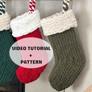 May include: Three handmade Christmas stockings in green, red, and olive green, each with a white cuff. The stockings hang from gold clips. The image includes the text "VIDEO TUTORIAL + PATTERN".