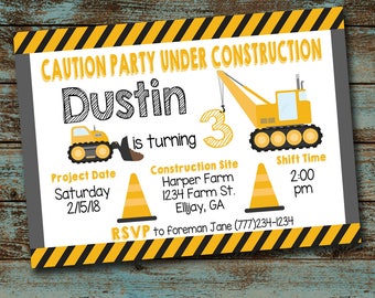 May include: A yellow and black construction themed party invitation for a child turning three. The invitation features a cartoon construction crane and a bulldozer. The text on the invitation reads "Caution Party Under Construction Dustin is turning 3".