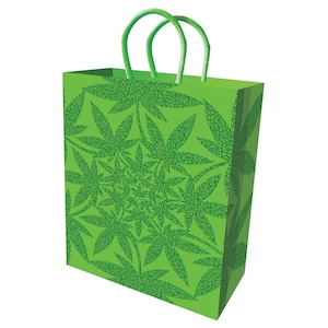May include: A green gift bag with a repeating pattern of cannabis leaves. The bag has green rope handles and a rectangular shape. The cannabis leaf pattern is a darker shade of green than the bag's background.