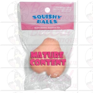 May include: A clear plastic package containing a light pink, squishy toy shaped like a cluster of balls. The package has a pink header with the words "SQUISHY BALLS" and "SLOW-RISING SQUISHY TOY". The text "MATURE CONTENT" is printed on the toy.