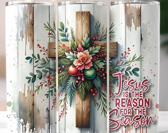May include: A stainless steel tumbler with a Christmas theme. The design features a wooden cross adorned with greenery, red berries, and ornaments. The text "Jesus is the Reason for the Season" is displayed on the side.