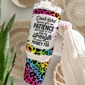 May include: A colorful tumbler with a leopard print design and the text "Dear Lord please give me PATIENCE BECAUSE IF YOU GIVE ME strength I'll need bail MONEY TOO".