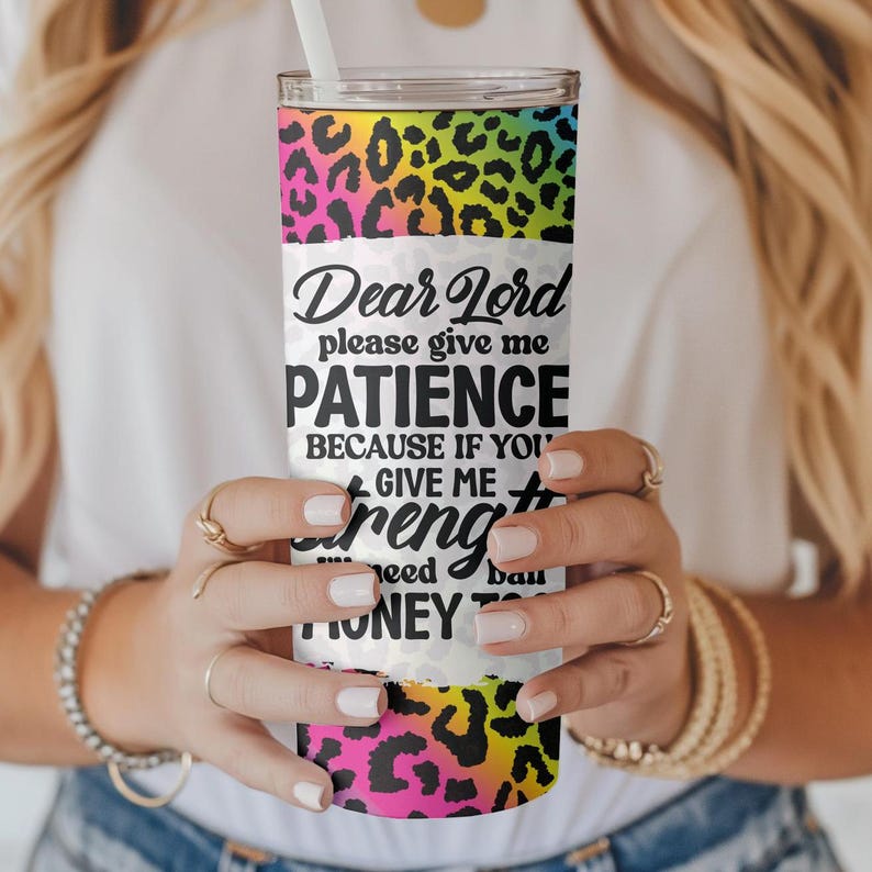 May include: A stainless steel tumbler with a white background and a leopard print design. The tumbler has a quote that reads "Dear Lord please give me PATIENCE because if you give me STRENGTH I'll need bail money to get out of jail".