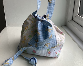 A patchwork Japanese Rice Bag made with pastel houses and dragonflies 100% cotton fabric