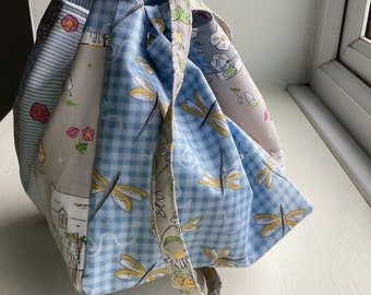 A patchwork Japanese Rice Bag made with pastel houses and dragonflies 100% cotton fabric