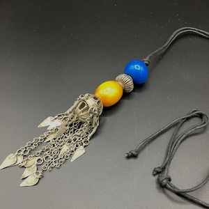 Ethnic necklace of vintage silver Afghan earring, Indian silver bead and vintage African resin and blue glass trade beads