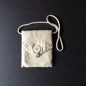 Natural linen handbag with antique Dayak shell and blue beads