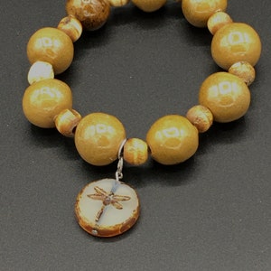 Bead bracelet with dragonfly charm