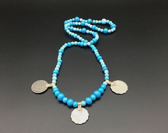 Ethnic necklace of old Pakistani coin pendants and vintage turquoise blue glass beads