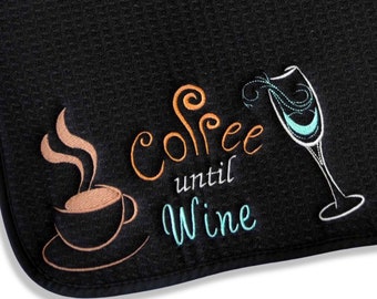 May include: Black kitchen towel with embroidered text "Coffee until Wine" with a coffee cup and a wine glass.