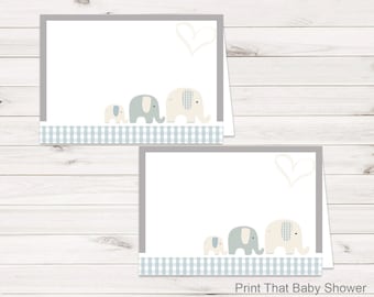 May include: Two baby shower invitation cards with a gray border and a light blue gingham pattern. The cards feature a family of elephants in light blue and cream colors. The text "Print That Baby Shower" and "Instant Digital Download!" are visible.