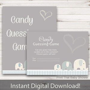 May include: Two gray baby shower game signs with the text "Candy Guessing Game". One sign has the words "Candy Guess Game" and a heart graphic. The other sign has the text "Candy Guessing Game" and a row of elephant graphics.