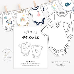 Op de afbeelding: Babyshower-spel met rompertjes, sommige versierd met een raket, regenboog en walvis. Het spel bevat een bord met de tekst "Decorate a Onesie" en "Baby Shower Games".