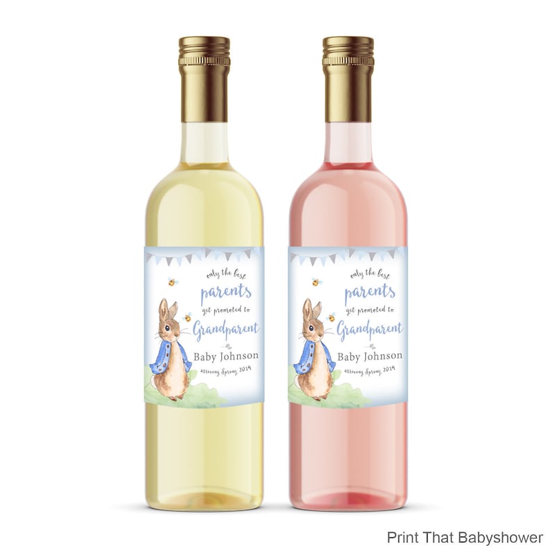 May include: Two wine bottles, one white and one pink, with gold caps. Each bottle has a label with the text "only the best parents get promoted to Grandparent" and a watercolour illustration of a rabbit. The text "Baby Johnson" is also on the label.